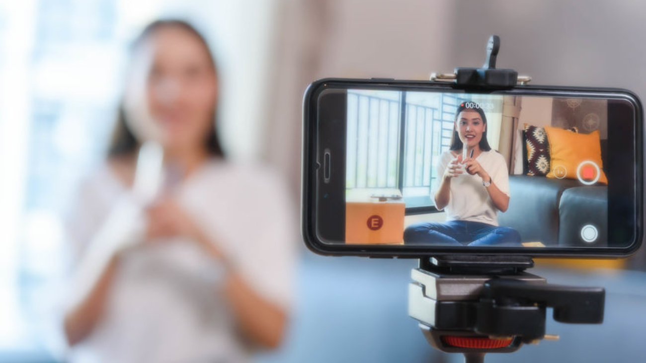 Beauty blogger demonstrating how to make up and review products on live broadcast use smartphone, life of an influencer