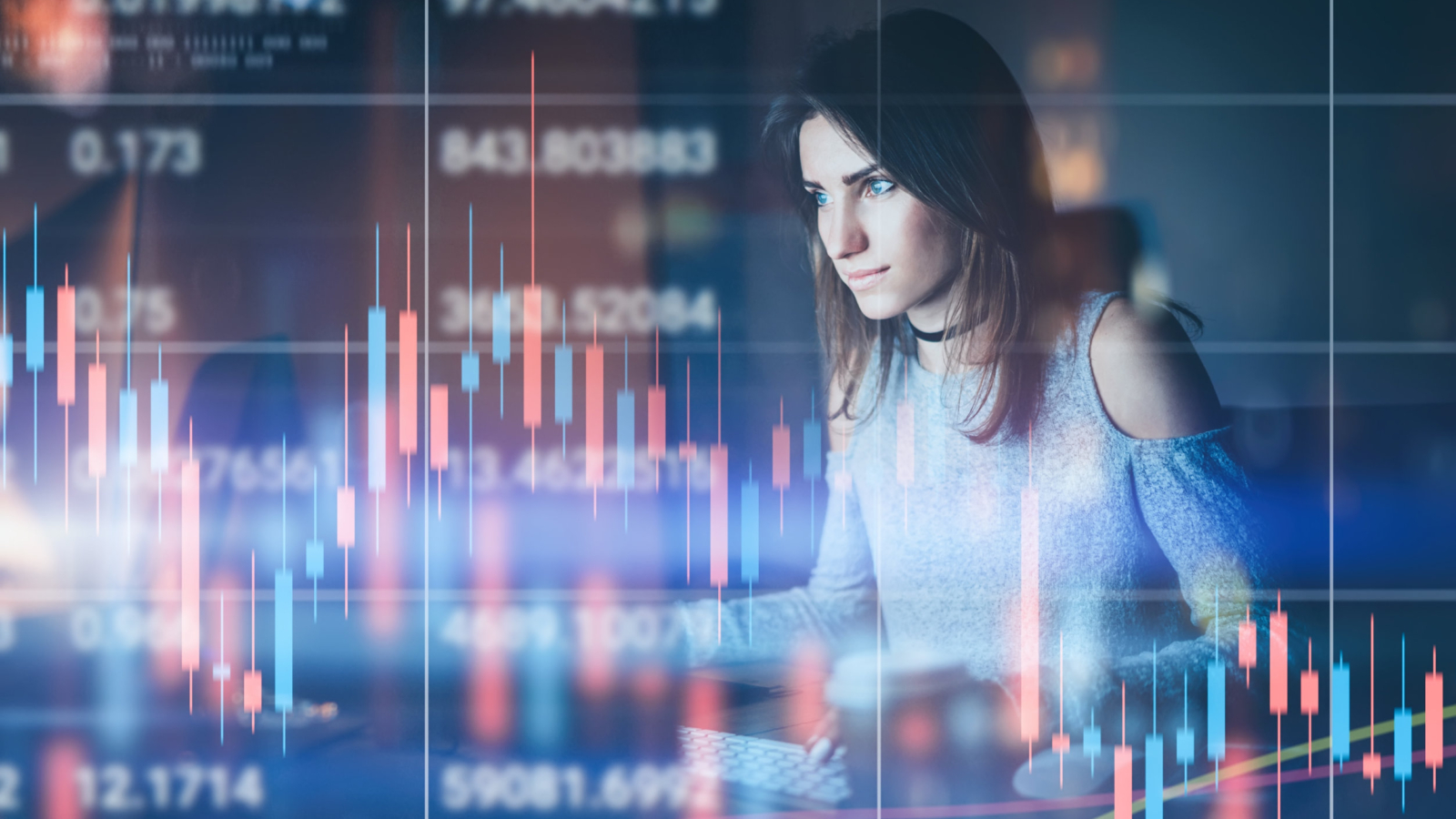 Young woman traider working at night modern office.Technical price graph and indicator, red and green candlestick chart and stock trading computer screen background. Double exposure